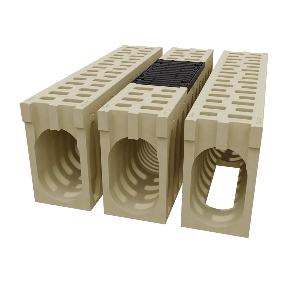 Three beige lightweight concrete blocks with large hollow centers lined up for wall construction.